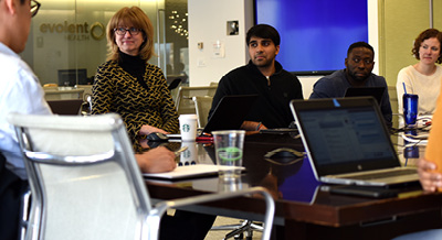 Employees sitting in office conference room 